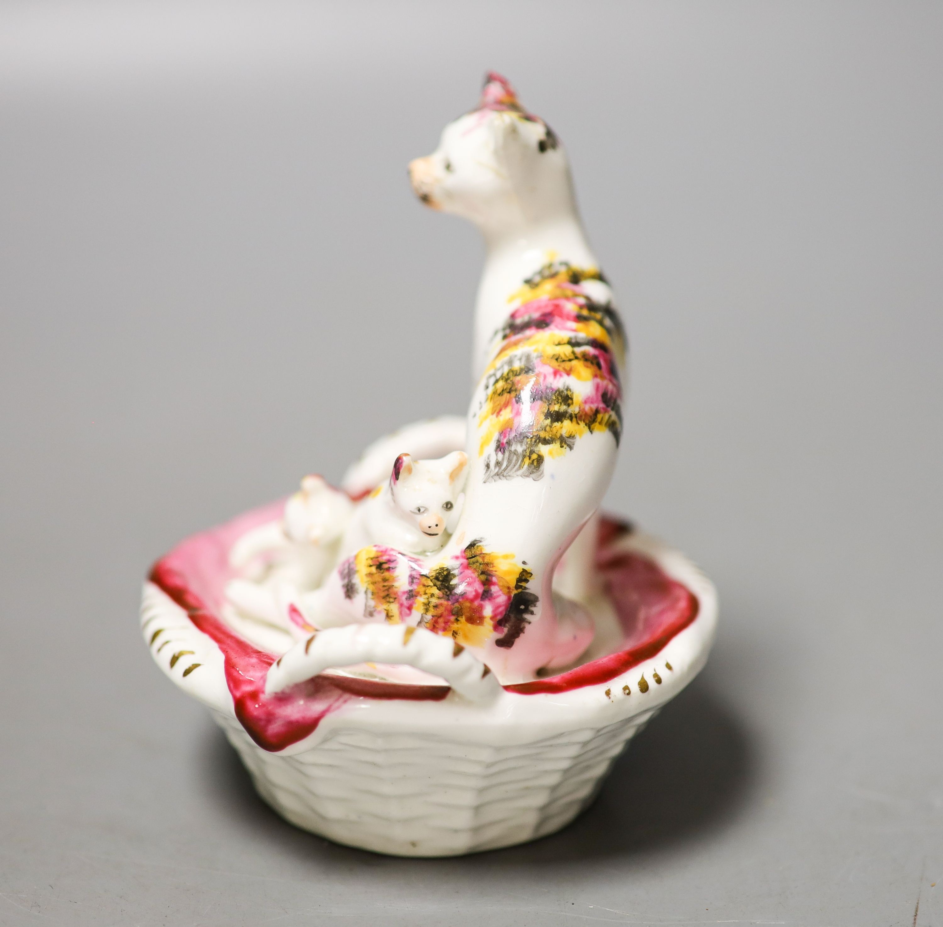 A Staffordshire porcelain group of a cat and kittens in a basket, c.1835-50 10cm